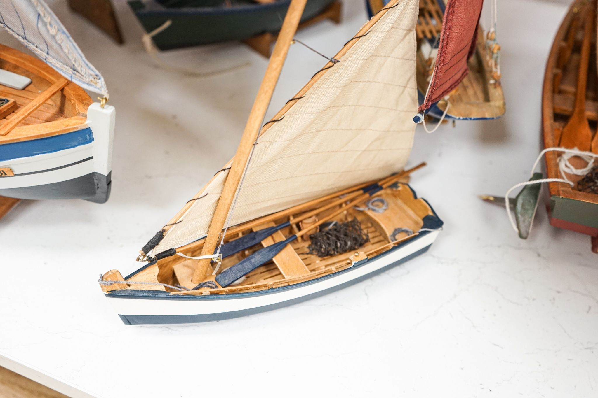 A group of six painted wood boat models